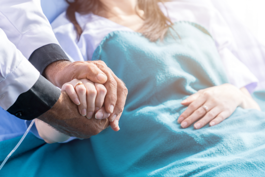 a doctor holding a patient hand