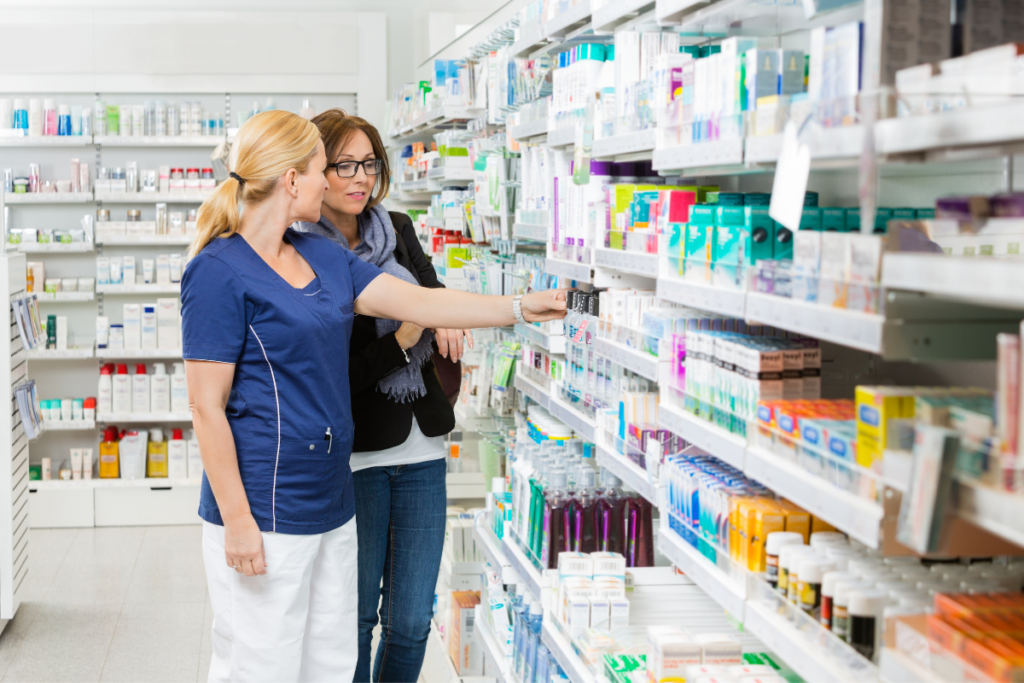 pharmacist helping shopper with Products