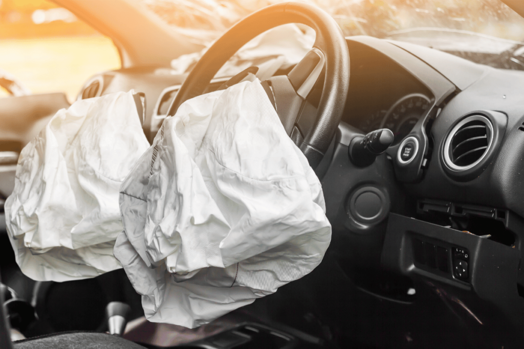 side view of an airbag deployed from steering wheel