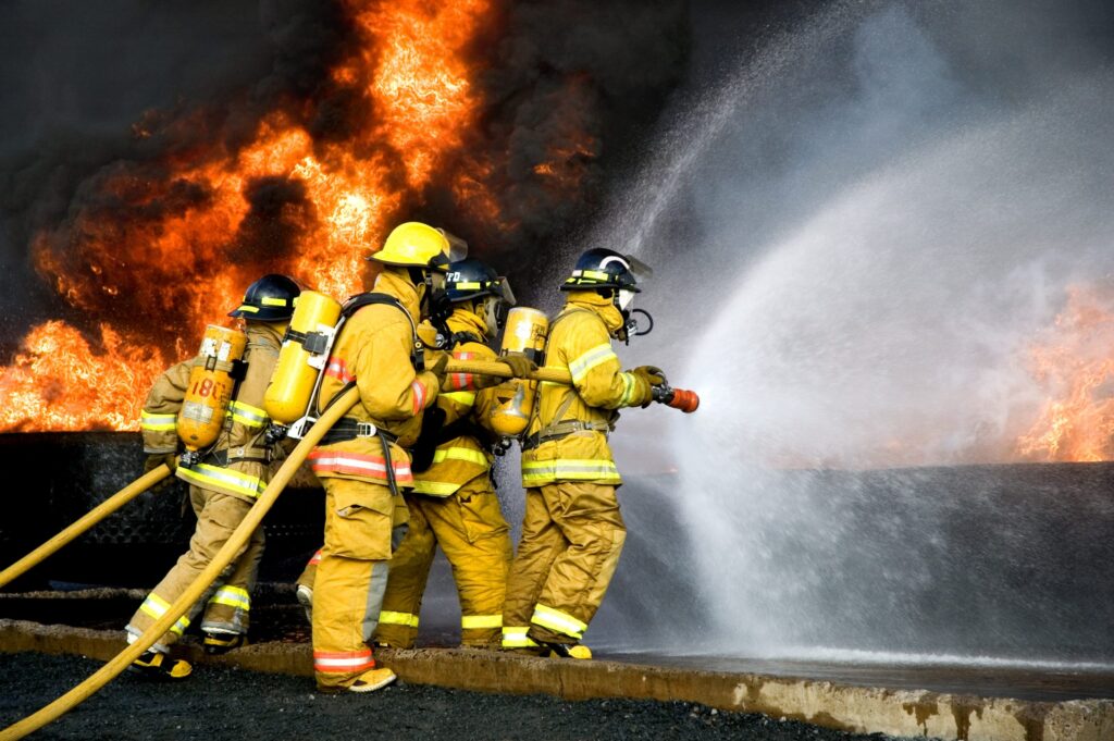 fire fighter extinguishing fire