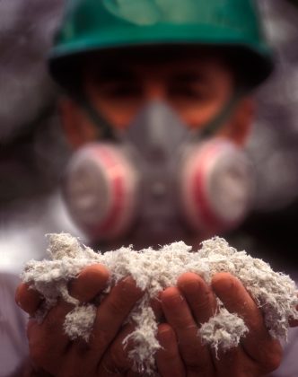 a man holding asbestos material