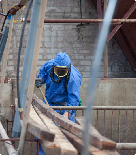 A fully kitted protective guy working in asbestos enviroment