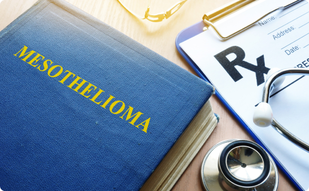 Mesothelioma textbook, stethoscope and patient record form on the table