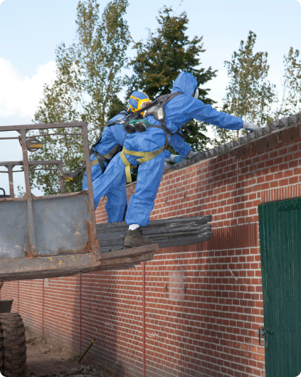 Two well kitted and protected men working in asbestos area