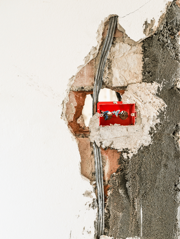 exposed electrical work in damaged drywall