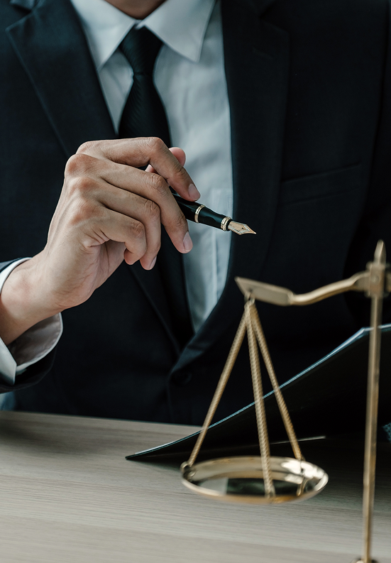 Closeup of a lawyers hand holding a pen. The Gori Law Firm Mesothelioma and Asbestos Exposure Lawyers