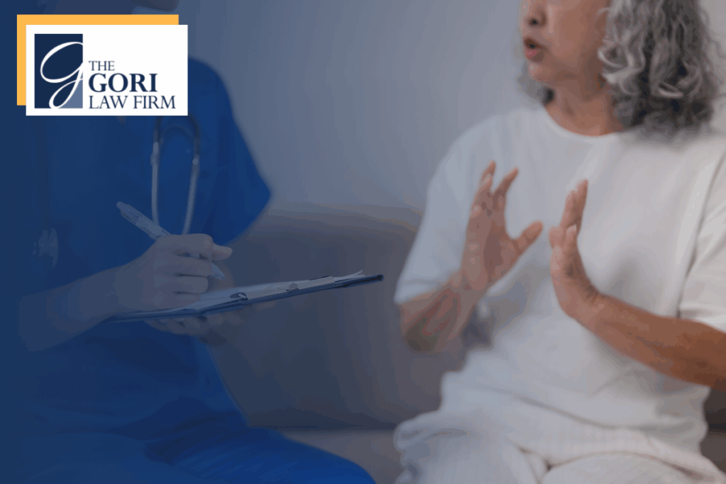 A nurse filling out her chart while a patient explains her symptoms