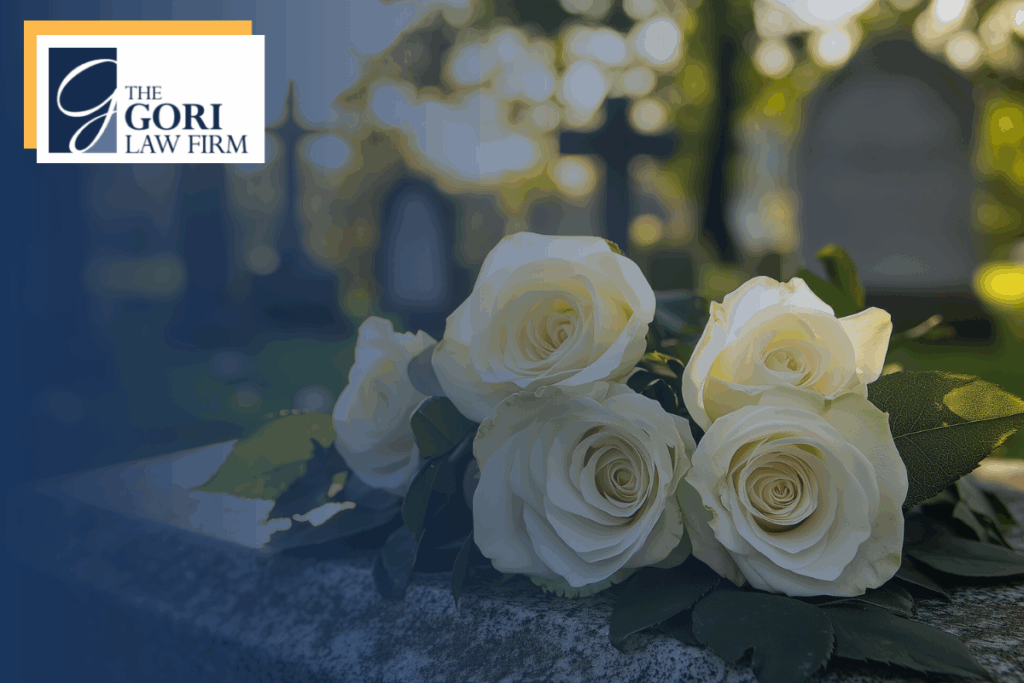 A floral arrangement resting on a tombstone.