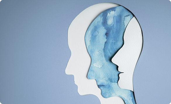 Papercut Head Silhouettes on Light Blue Background